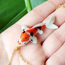 Koi Necklaces in Polymer Clay. Un proyecto de Bellas Artes, Diseño de jo, as y Escultura de Marisa Clemente - 04.06.2018