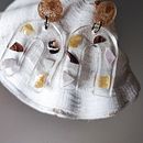 Meu projeto do curso: Design de joalheria com resina. Un projet de Création d'accessoires, Artisanat, Design de bijoux , et DIY de Marina Dominguez - 02.12.2022