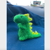 Needle felted dinosaur. Fiber Arts project by Ama Warnock - 04.19.2021