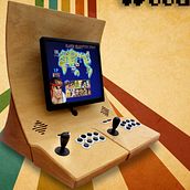 WoodCade - Fliperama rústico com controle removível. Een project van  Ontwerp, Meubelontwerp en -bouw, Industrieel ontwerp, Productontwerp, Speelgoedontwerp y  Creativiteit van Renan Romão - 25.05.2016