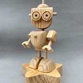 JAMIU robot de madera. Projekt z dziedziny Projektowanie postaci, Rzeźba, Projektowanie zabawek, To, art, Obróbka drewna, Design, Kreat i wność użytkownika Jaime Humberto Hernandez Benincore - 30.08.2021
