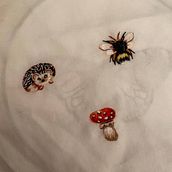 My project for course: Miniature Needlework: Make Embroidered Jewelry. Jewelr, Design, Embroider, and Textile Design project by lenira.gorbunova - 05.23.2022