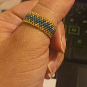 Mi proyecto del curso: Diseño de accesorios con cuentas: teje patrones elegantes . % Alexandra Mella tarafından hazırlanan Aksesuar Tasarımı, Sanat ve El Sanatları, Mücevher Tasarımı, El, Ve af Sanatları projesi - 07.21.2023