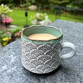 Stamped mug, flared, and with rounded bottom. Ceramics project by lisacappello23 - 07.27.2023