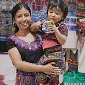 Marta en la tienda de su mamá Maria, en el mercado de artesanias de La Antigua Guatemala, Guatemala. Abril del 2024.. Photograph project by julioderas96 - 04.07.2024