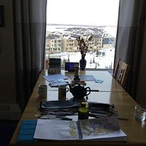 My table with window. I live in northern Canada. It was already dark so there was no view.  I now added colour and the view.. Un projet de Dessin au cra , et on de S Carriere - 09.11.2020