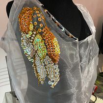 Mi proyecto del curso: Bordado de moda: embellece tu ropa con mostacillas Ein Projekt aus dem Bereich Modedesign, Stickerei, DIY, Upc, cling und Textildesign von Denise Glibota - 17.06.2024