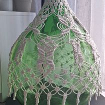 Rivestimento di una damigiana in macramè. Decoration, Accessor, Design, Interior Design, Macramé, Fiber Arts, and Textile Design project by Annalaura Giannelli - 12.28.2025