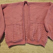 Cardigan en rosa . Crochê, DIY, Design de moda, Tecido, e Design têxtil projeto de ximena_munoz - 11.05.2026