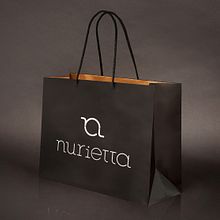 BRANDING INTEGRAL. nurietta, moda infantil. Málaga.. Un proyecto de Br, ing e Identidad, Dirección de arte, Diseño gráfico y Tipografía de Manuel J. Morente Morente - 30.01.2018