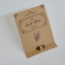 DISEÑO PACKAGING EARTH PILLS. Een project van Traditionele illustratie y Packaging van Belen Bardon Lores - 20.06.2018