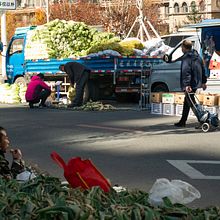 Rural Workers selling their products in the city  - Changchun, China . Photograph, and Street Art project by adriasc12 - 10.17.2022
