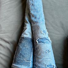 Jeans mended with sashiko stitching methods. Embroider, Fiber Arts, DIY, Upc, cling, and Textile Design project by Adrienne R - 01.21.2024