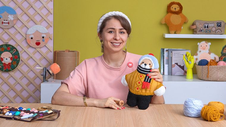 Design e bordado de bonecos com agulha mágica