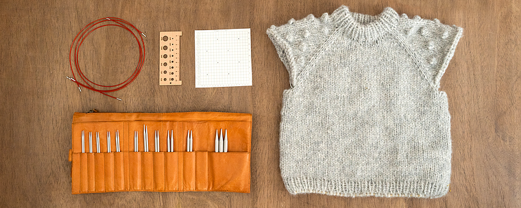 Merajut dengan raglan dari atas