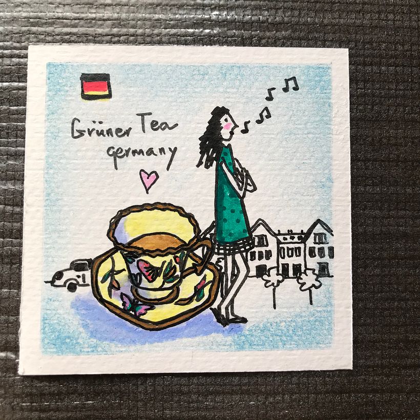 A girl who collects hand drawn cup sets at her holiday in Germany