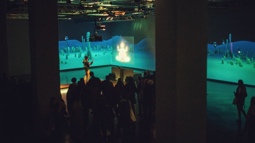 People engaging during the opening night of the exhibition.