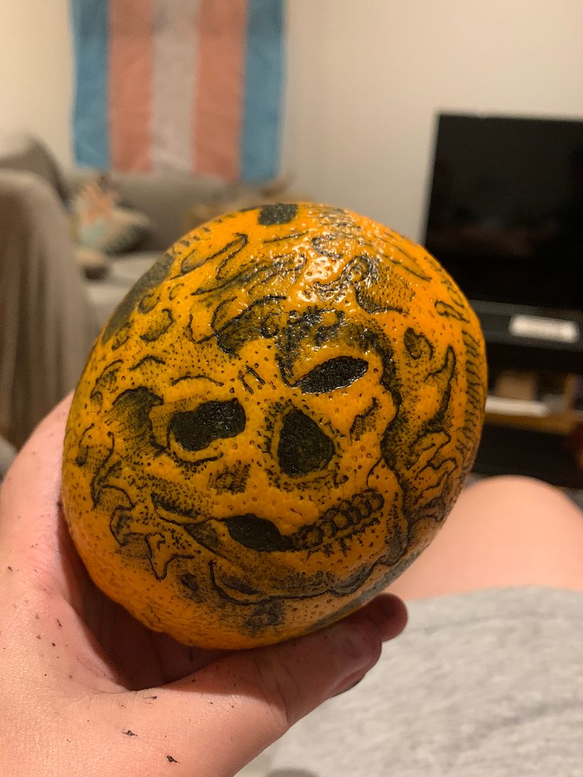 A bit messy as I practiced the techniques over the whole of the orange as well as putting the final skull design on it.