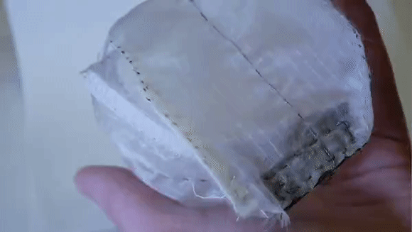 A translucent fabric juggling ball shell with velcro for interfacing with capacitive thread