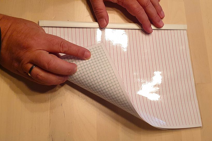 One side is checkered and the other is striped.