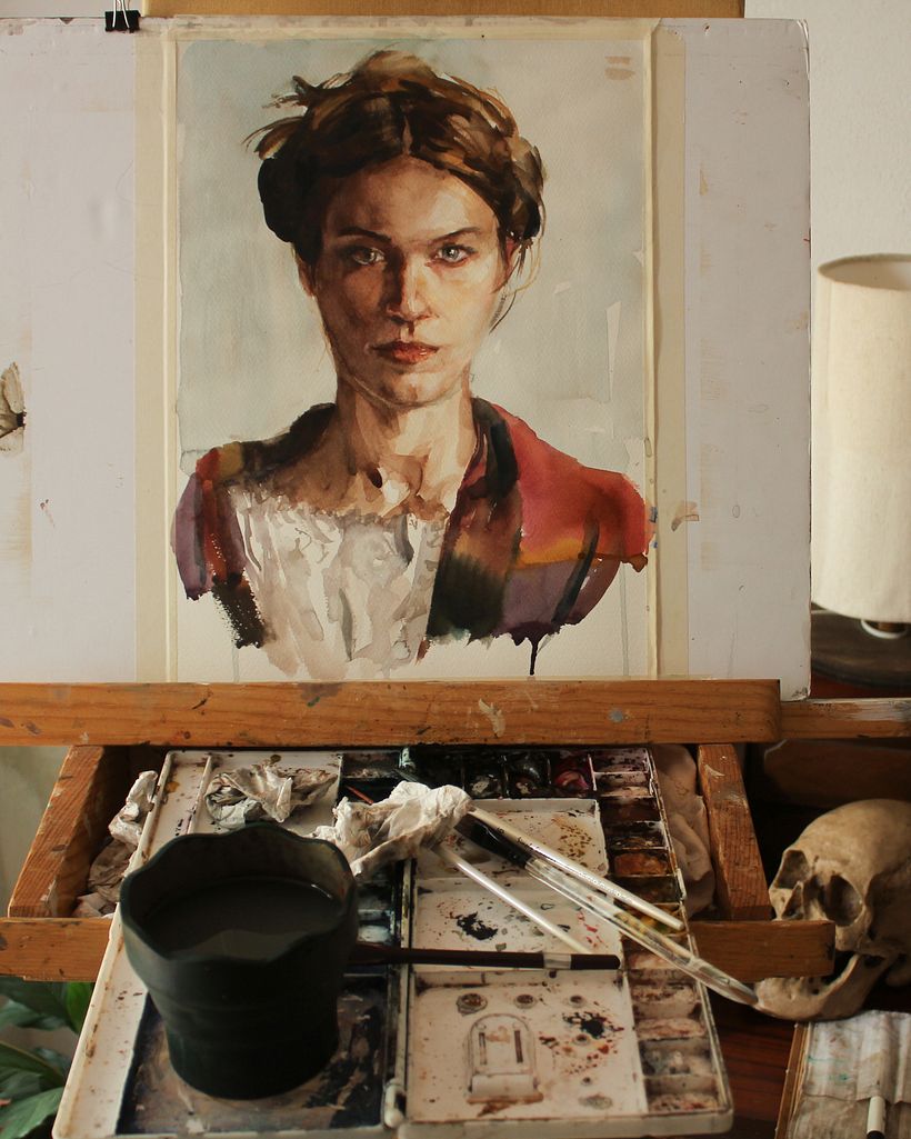 On the easel. I like to paint standing at my easel fixing the paper to a rigid support.