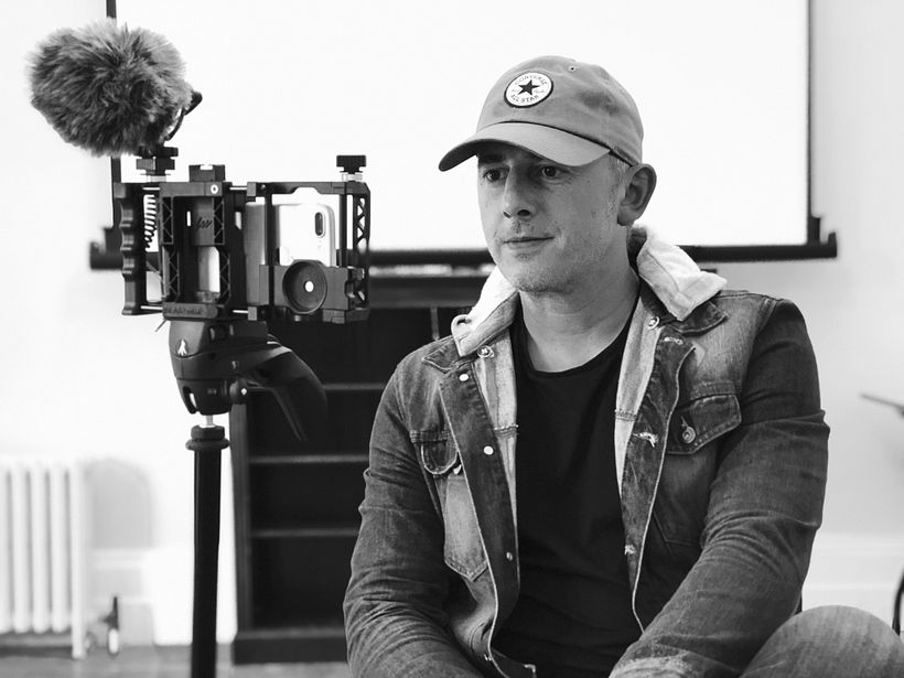 Cassius being interviewed about a music video being shot using a mobile.