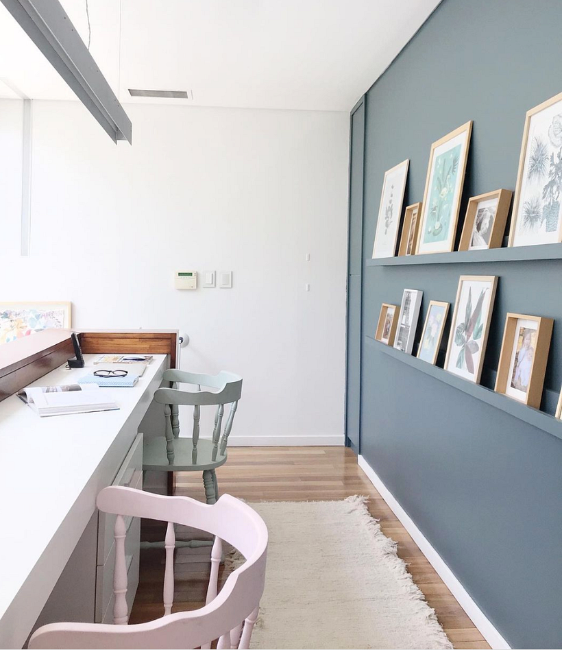 Shelves with framed pictures that can be moved around