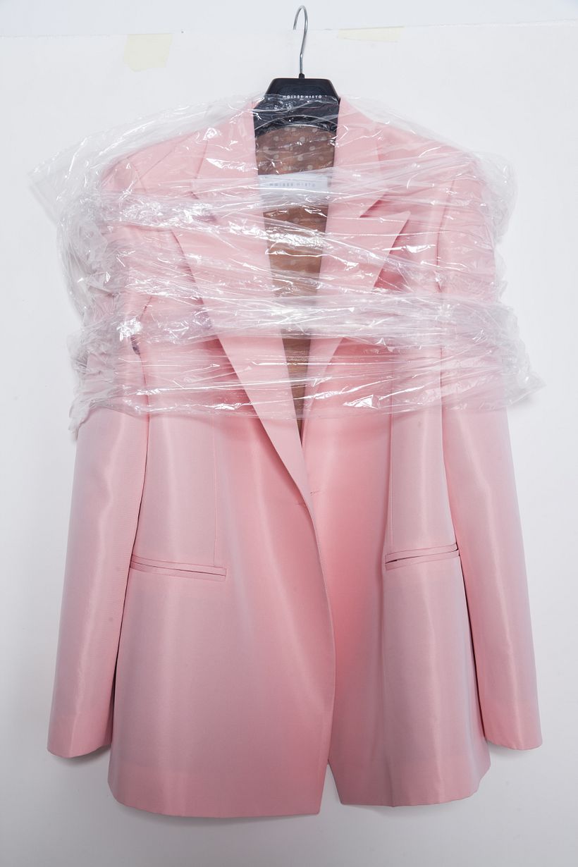 Prototype of a pink blazer. We tried the garment on a hanger to see how it looks.