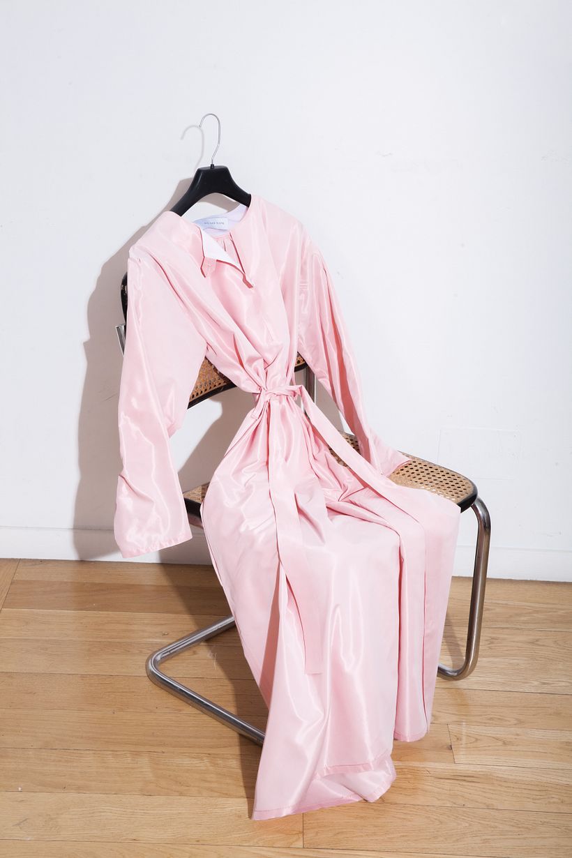 image of a dress from the collection on a chair.