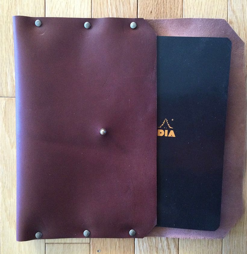 Notebook sleeve open to show how notebook is inserted.