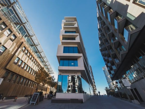 Three-point perspective is used when drawing buildings seen from a high or low eye level