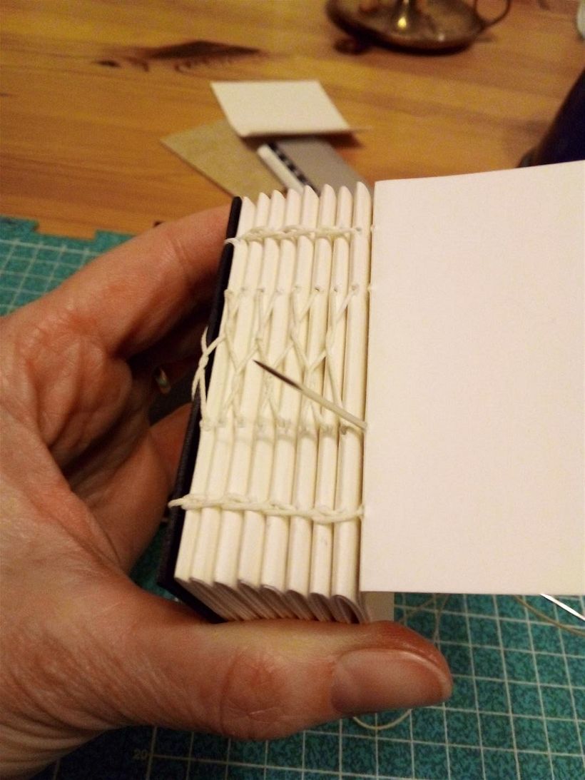 Stitching up some sturdy cartridge paper
