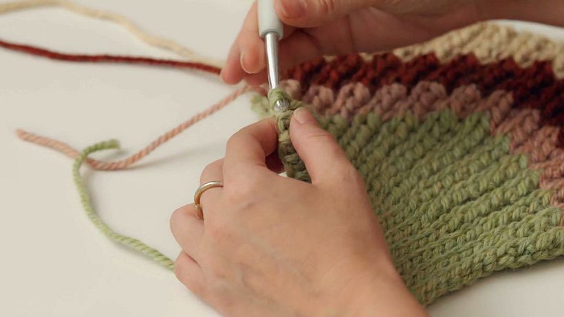 Buy individual needles until you know for sure that crochet is for you