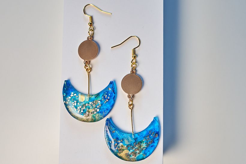 Moon drop earrings, made with glitter and blue and gold alcohol ink.