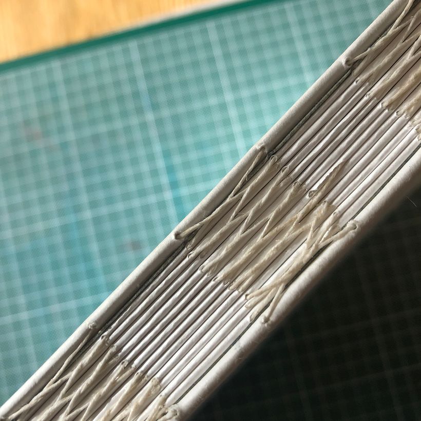 Stitching the pages together- not quite right but I got the hang of it.