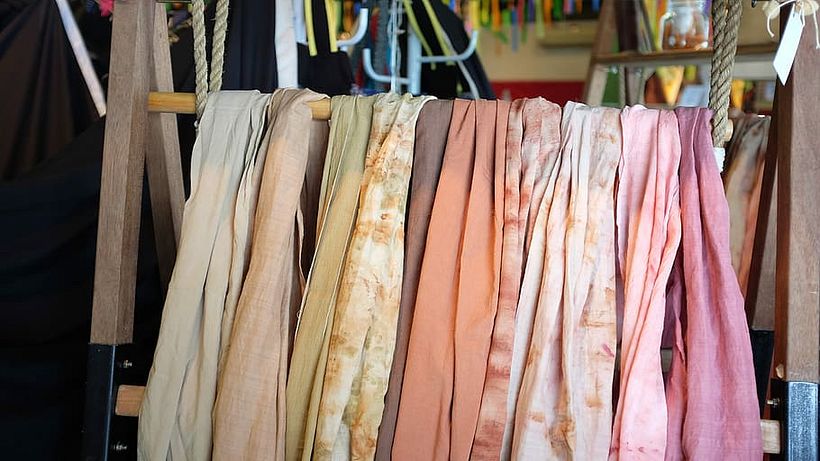 Examples of fabrics that have been dyed using shibori techniques.