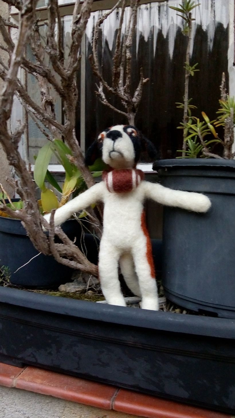This is Sam, the Half Dog. He looks like a Saint Bernard, and carries a small barrel in his neck.