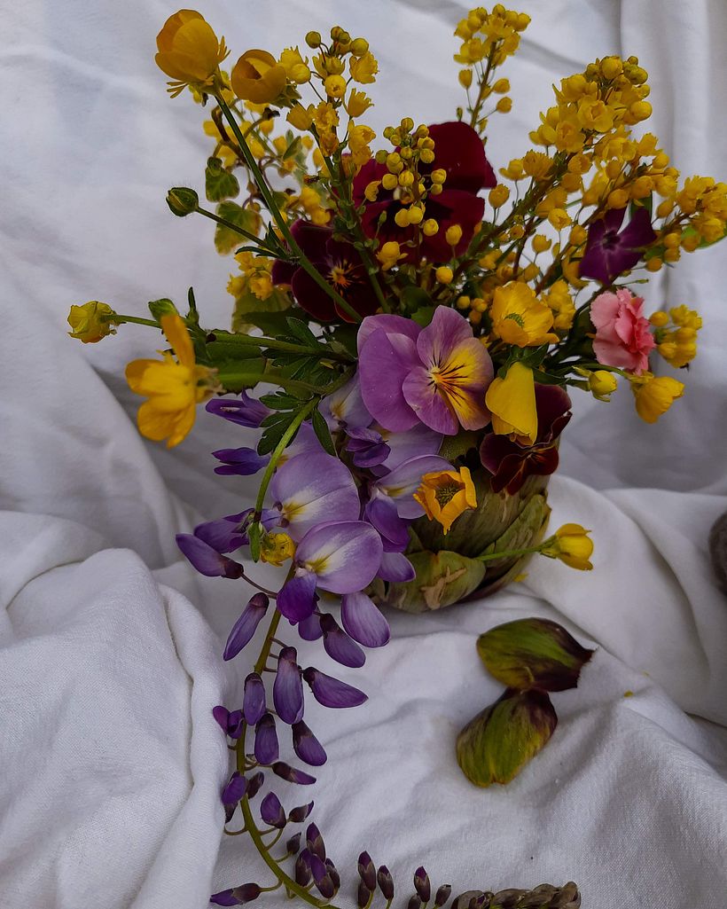 Wisteria and wildflowers inside an artichoke  0