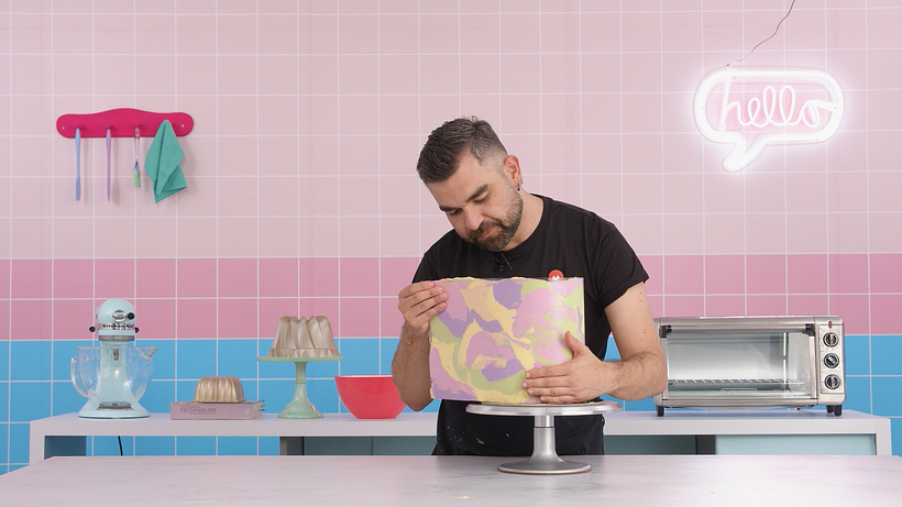 Check there are no air bubbles between the cake and the acetate by pressing down on it with your hands to release any air.