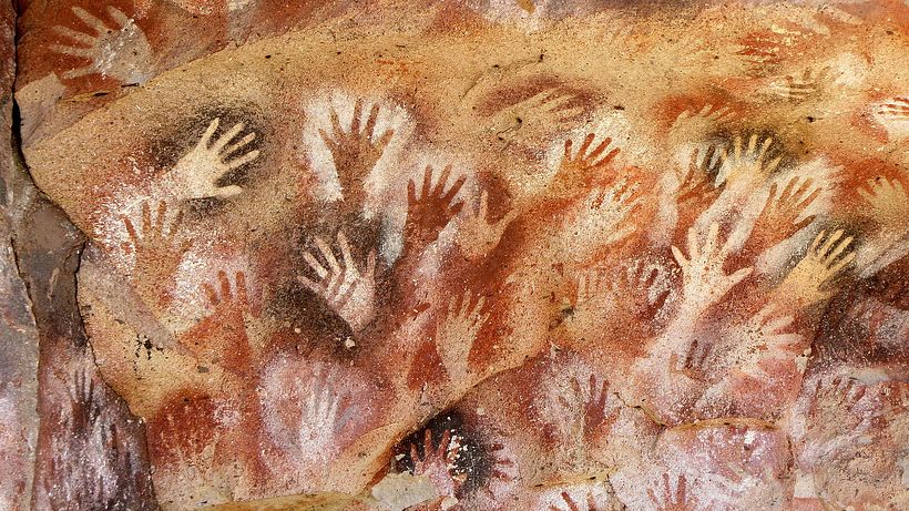 Stenciled hands made using a type of bone airbrush in the Cueva de las Manos (Argentina).