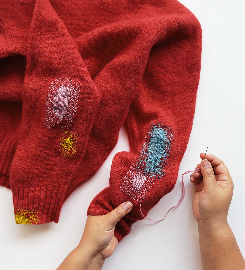 Mended sweater by Arounna Khounnoraj