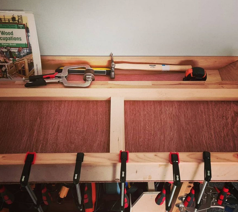 A whole load of clamps, helping glue the lip to the front.