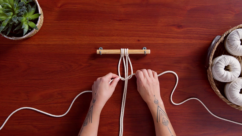 Fasten the knot at the top of the cords, tight in to the wood.
