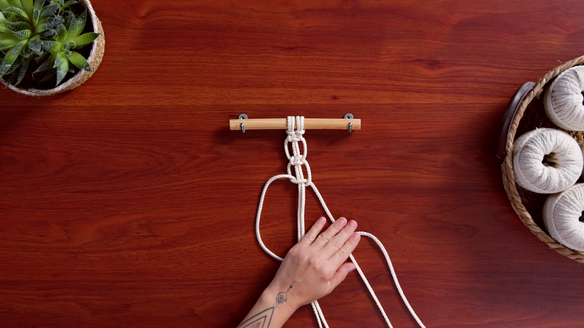 Stretch the filler cord out with one hand as you tie each knot.
