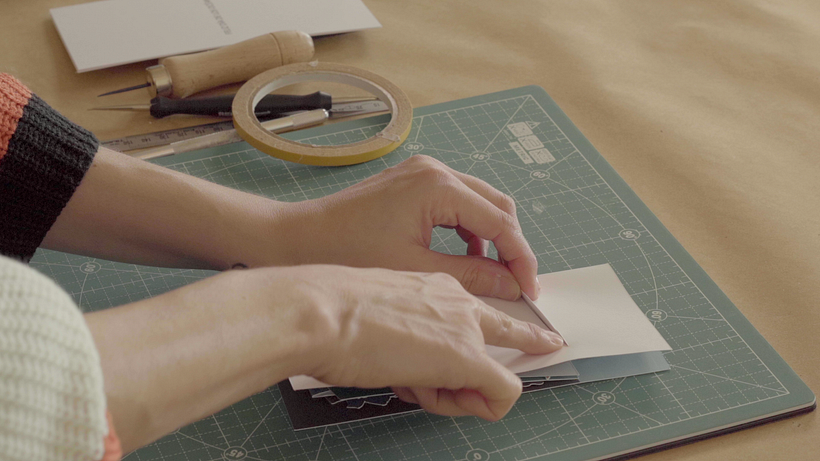 Attach the tabs using double-sided sticky tape.
