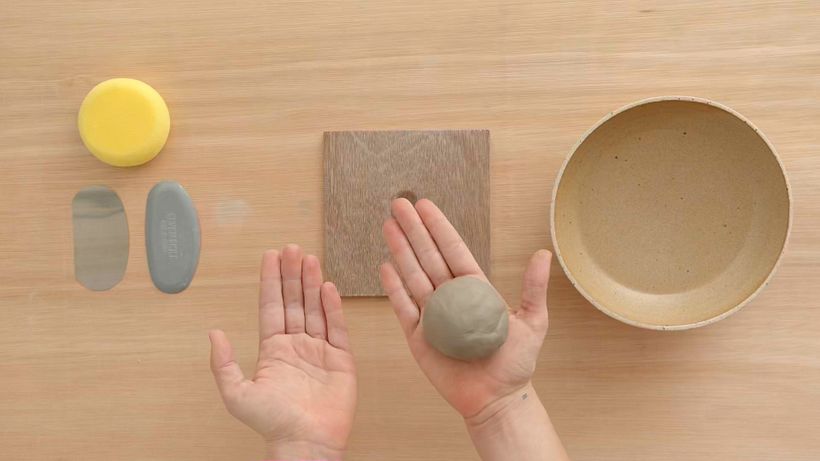 Roll a ball of clay to fit the palm of your hand