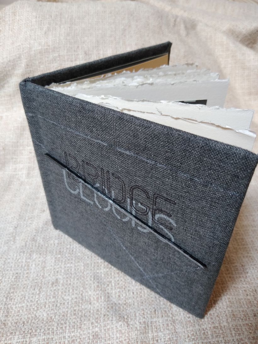 Cover: Bridges Clouds: cloth cover embellished with paint, ink and cardboard