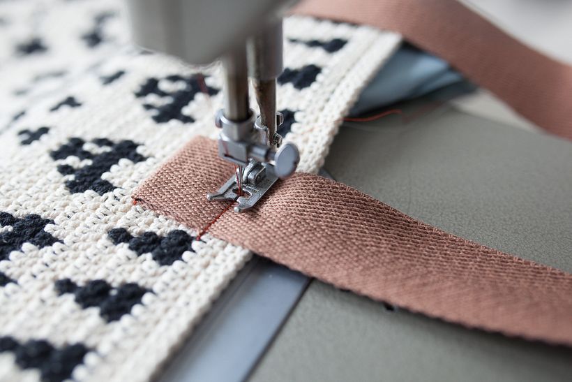 Sewing a handle in place, Folkki tote bag.