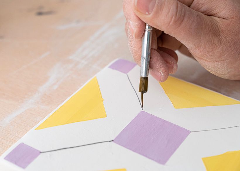 After the tile has been fired and glazed, you can begin decorating.
