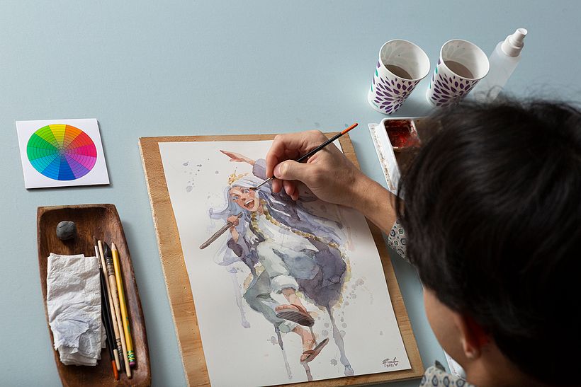 Geoff trabajando con los materiales básicos para crear manga en acuarela.